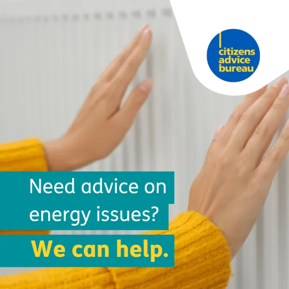 Two hands resting against a radiator to check the heat